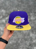 DYNASTY FITTED MITCHELL & NESS LOS ÁNGELES LAKERS (PURPLE YELLOW) HAT
